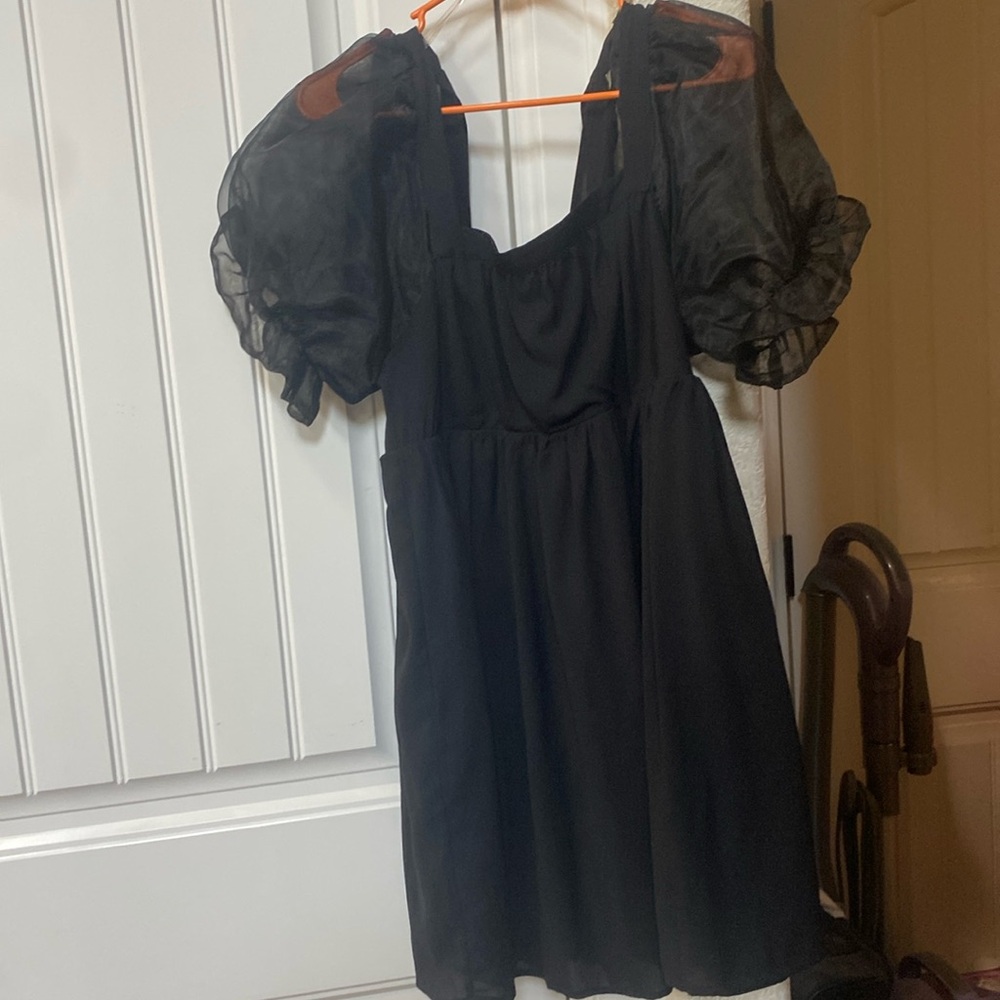 Black dress with puffed sleeves